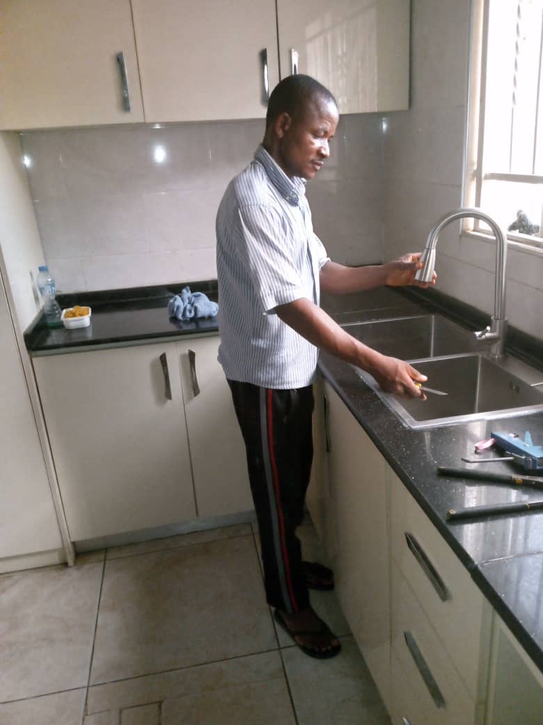 Kitchen sink and tap installation in progress
